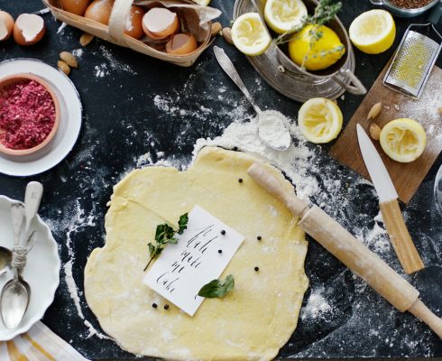 dough-and-flour-near-lemons-and-rolling-pin-1070880
