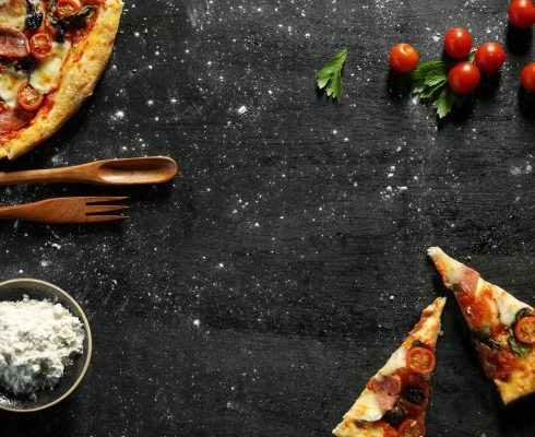 foodiesfeed.com_messy-pizza-on-a-black-table